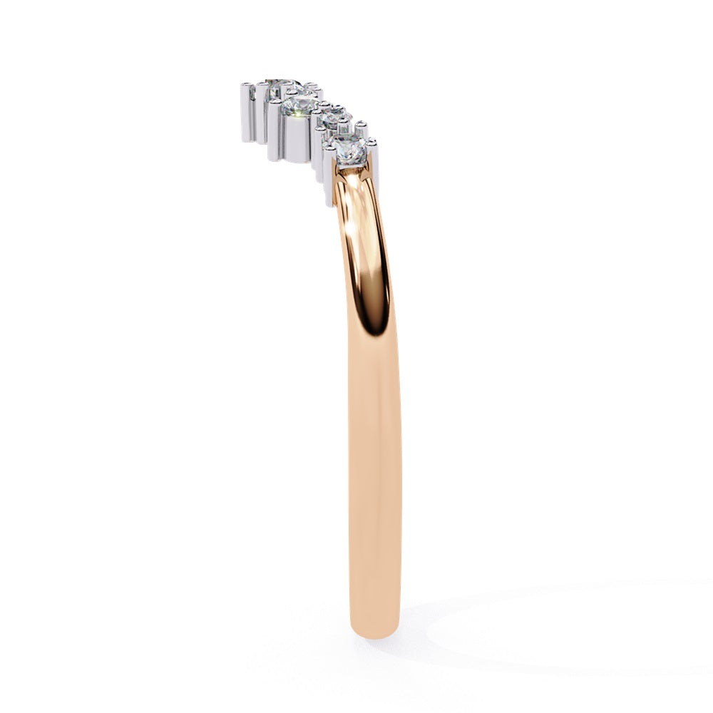The Timeless Diamond Chevron Band by Niraa is a luxury accessory featuring a gold band with a row of seven small, sparkling diamonds in a crescent shape. The larger central stone creates a tiara-like design, epitomizing elegance when photographed against a white background.