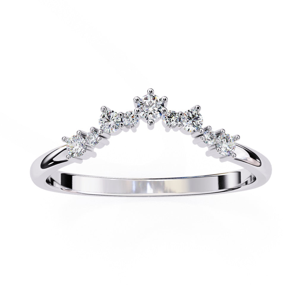 The Timeless Diamond Chevron Band by Niraa is a luxury accessory featuring a gold band with a row of seven small, sparkling diamonds in a crescent shape. The larger central stone creates a tiara-like design, epitomizing elegance when photographed against a white background.
