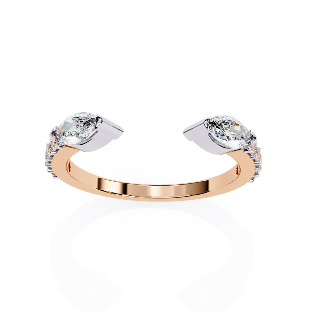 The Niraa Marquise Diamond Open Band is a luxury accessory with gold and silver featuring large marquise-cut diamonds at each end. Smaller rectangular diamonds sparkle on the sides, set against a plain white background.