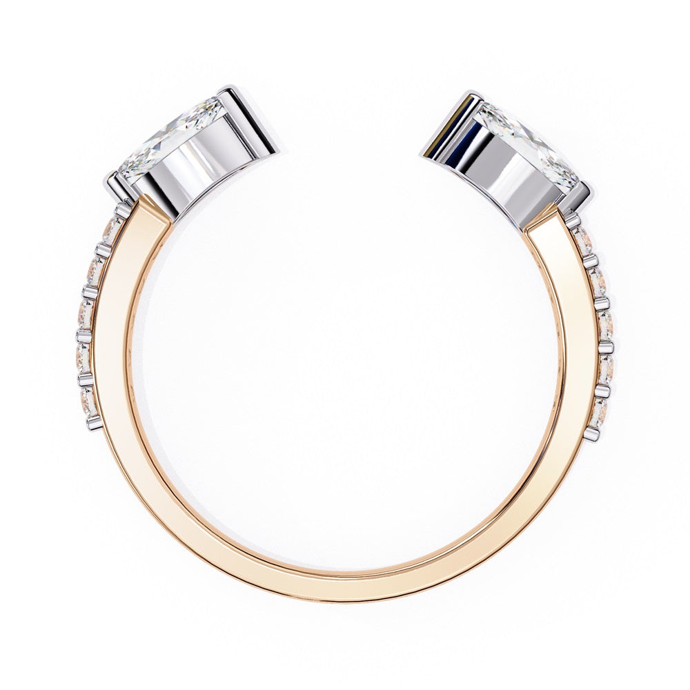 The Niraa Marquise Diamond Open Band is a luxury accessory with gold and silver featuring large marquise-cut diamonds at each end. Smaller rectangular diamonds sparkle on the sides, set against a plain white background.