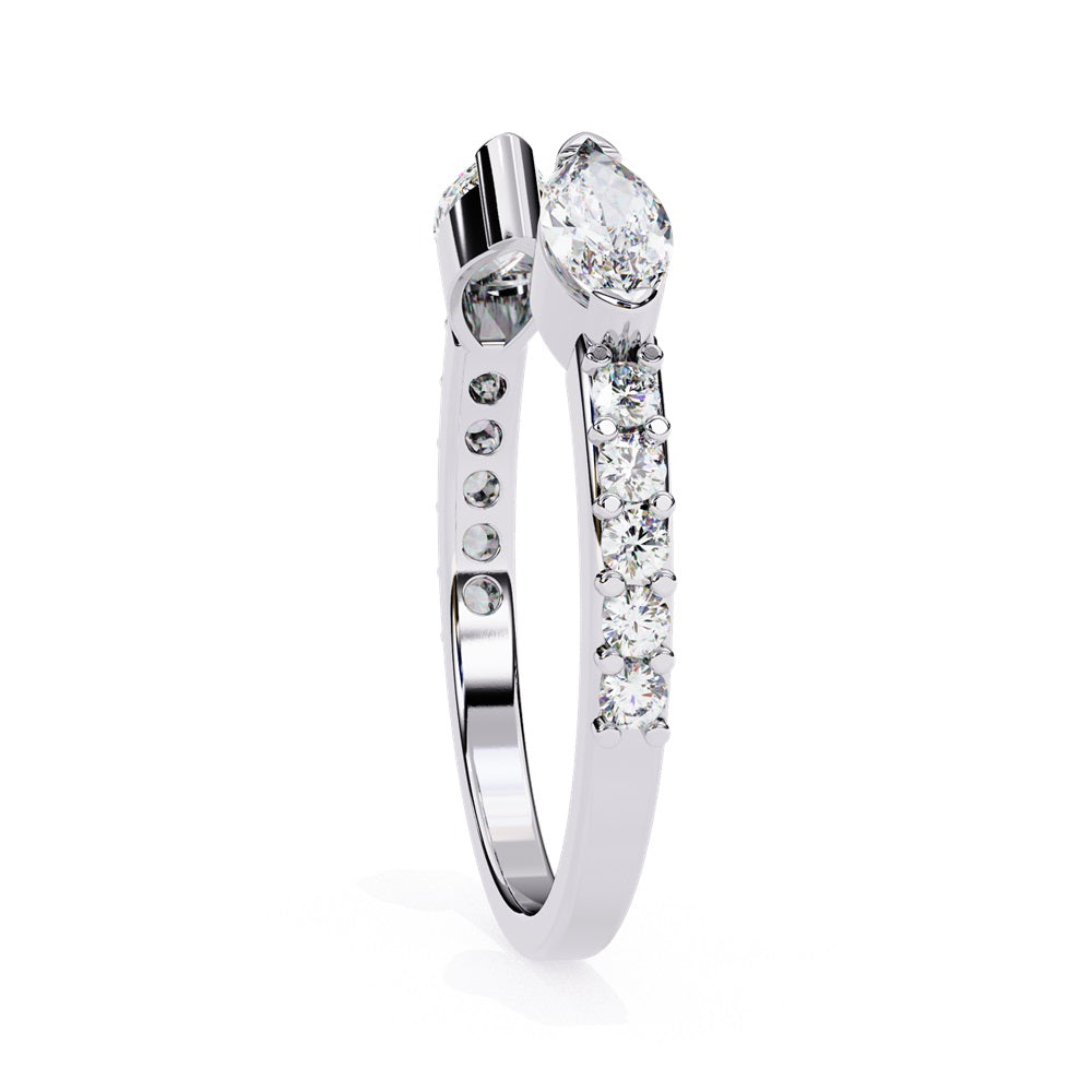 The Niraa Marquise Diamond Open Band is a luxury accessory with gold and silver featuring large marquise-cut diamonds at each end. Smaller rectangular diamonds sparkle on the sides, set against a plain white background.