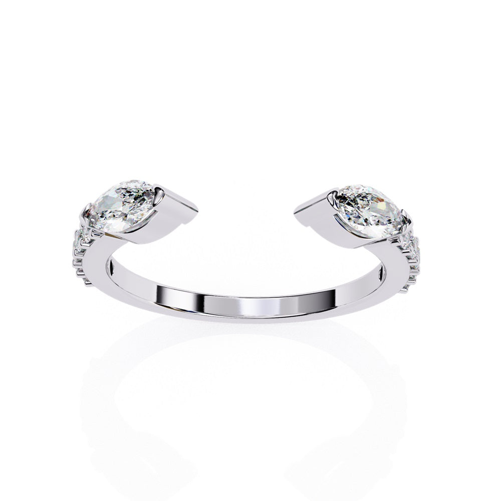The Niraa Marquise Diamond Open Band is a luxury accessory with gold and silver featuring large marquise-cut diamonds at each end. Smaller rectangular diamonds sparkle on the sides, set against a plain white background.