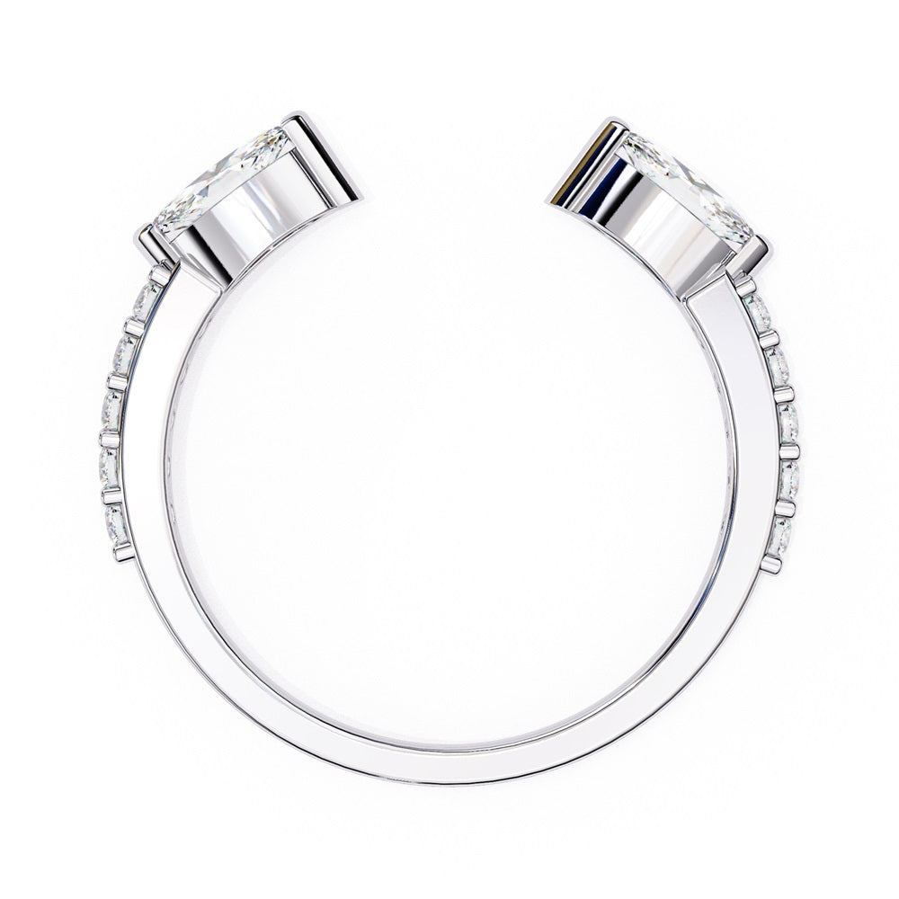 The Niraa Marquise Diamond Open Band is a luxury accessory with gold and silver featuring large marquise-cut diamonds at each end. Smaller rectangular diamonds sparkle on the sides, set against a plain white background.