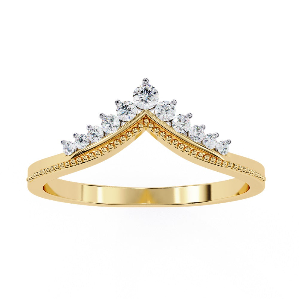 The Tiara Diamond Chevron Band by Niraa showcases a crown-like elegance with its gold band and row of sparkling diamonds, highlighted by a larger central diamond at the peak—an epitome of luxury.