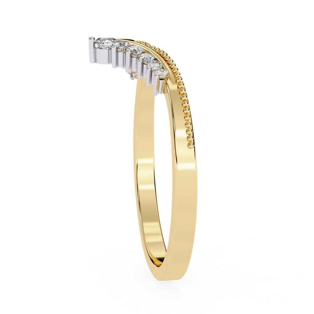 The Tiara Diamond Chevron Band by Niraa showcases a crown-like elegance with its gold band and row of sparkling diamonds, highlighted by a larger central diamond at the peak—an epitome of luxury.