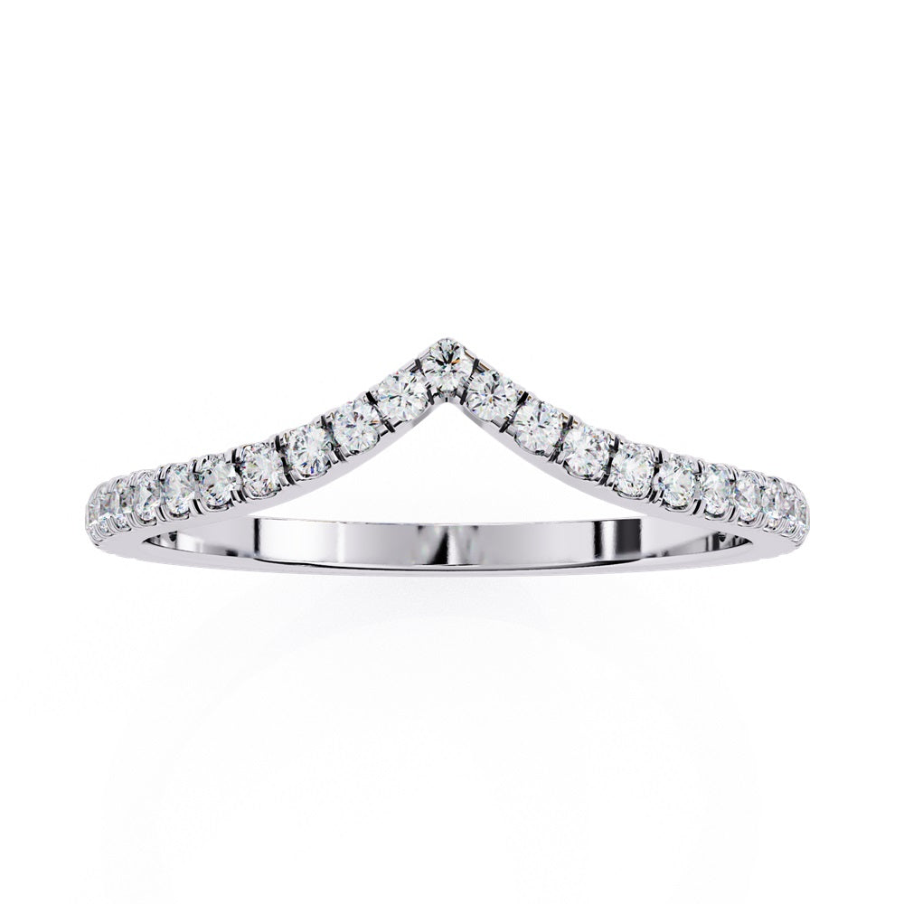 The Stackable Diamond Chevron Band by Niraa is a thin gold ring featuring a chevron design with sparkling diamonds on the top edge, perfect for your stackable ring collection against a white background.
