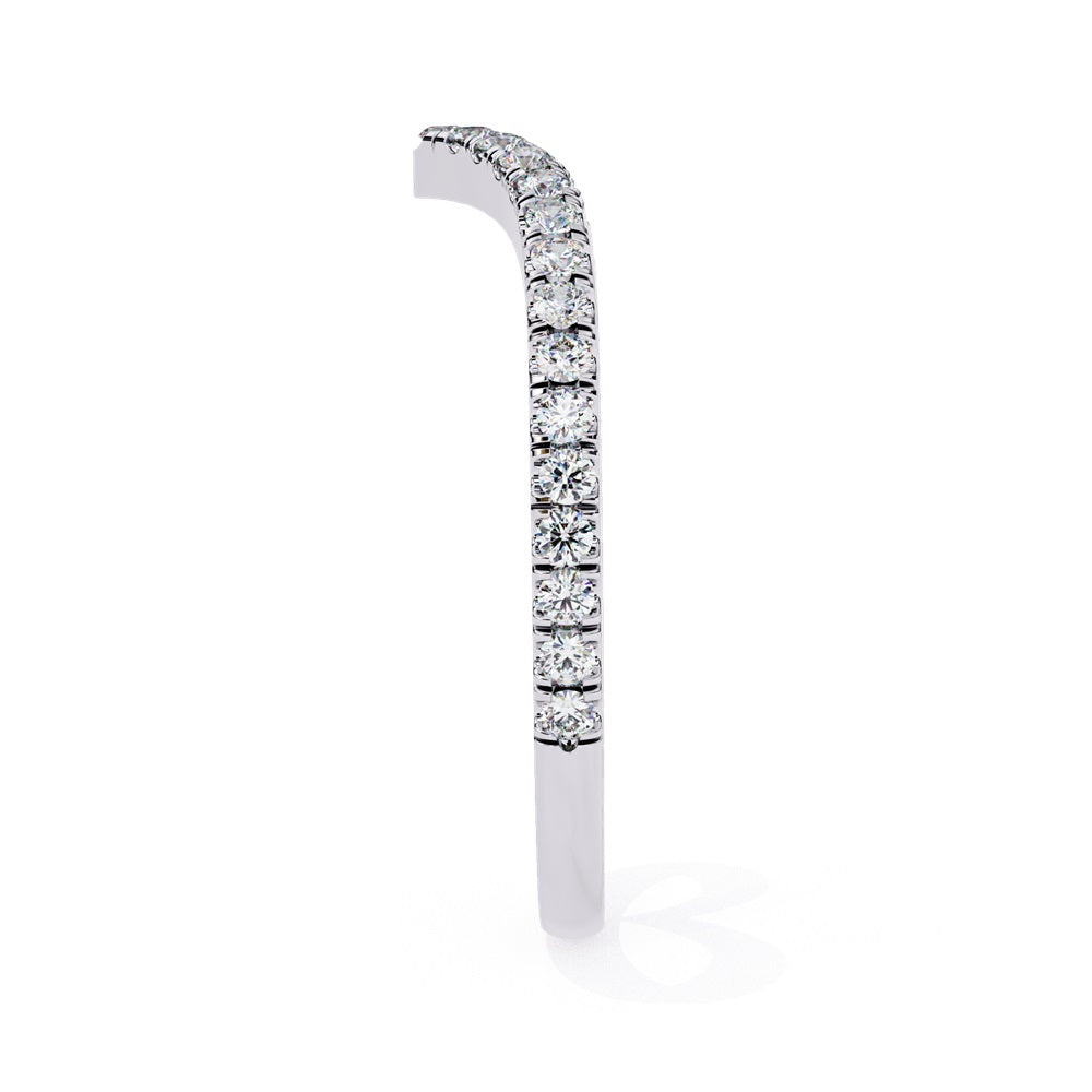 The Stackable Diamond Chevron Band by Niraa is a thin gold ring featuring a chevron design with sparkling diamonds on the top edge, perfect for your stackable ring collection against a white background.