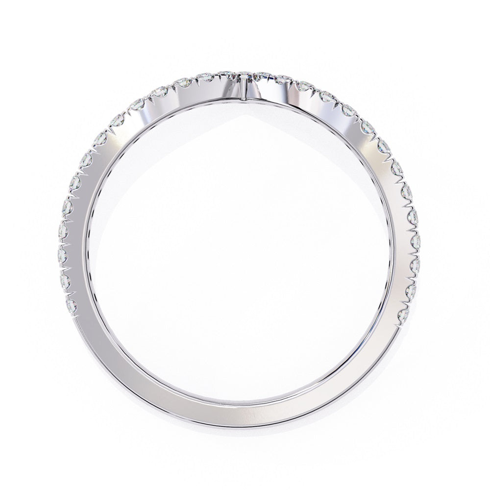 The Stackable Diamond Chevron Band by Niraa is a thin gold ring featuring a chevron design with sparkling diamonds on the top edge, perfect for your stackable ring collection against a white background.