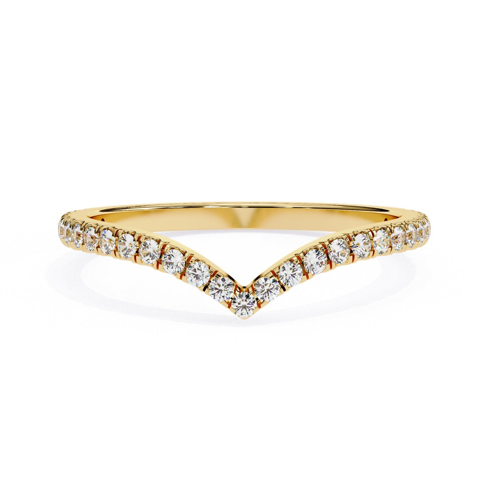 The Stackable Diamond Chevron Band by Niraa is a thin gold ring featuring a chevron design with sparkling diamonds on the top edge, perfect for your stackable ring collection against a white background.