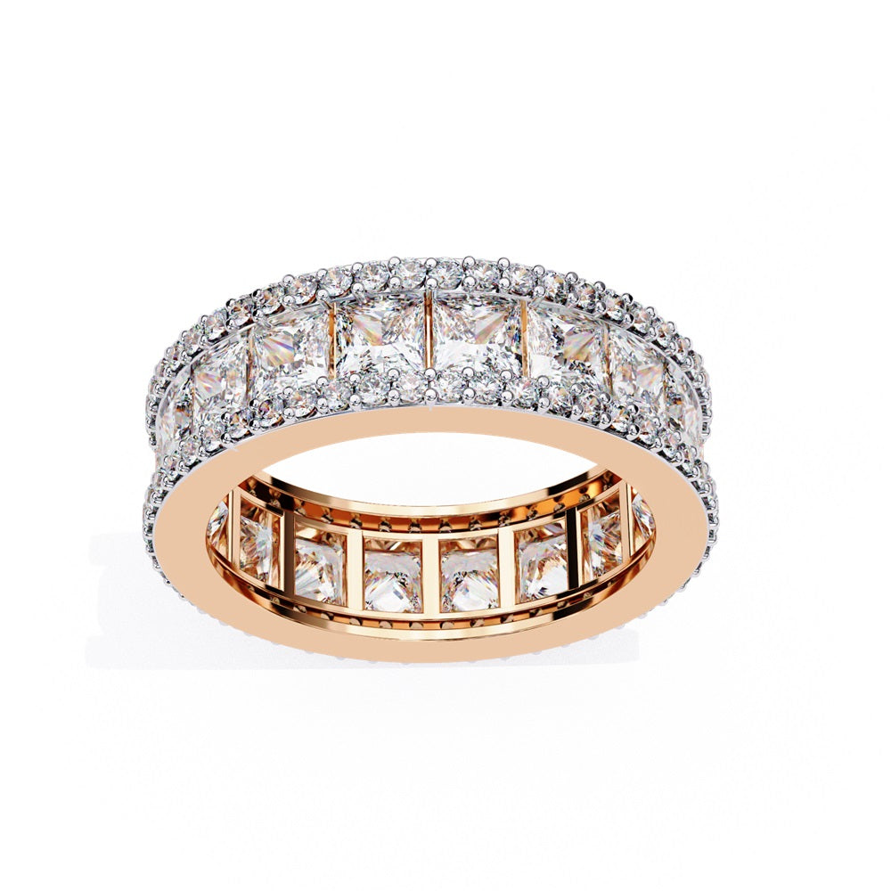 The Niraa Princess Cut Diamond Eternity Band showcases a princess-cut diamond centerpiece, framed by rows of smaller round diamonds.
