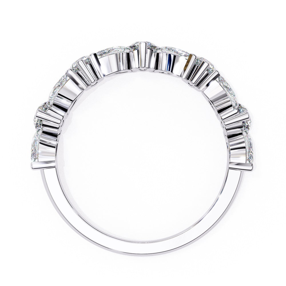 The Symphony Diamond Band by Niraa is a luxurious gold and silver ring with a central round diamond, flanked by marquise-cut diamonds for an elegant, symmetrical design.