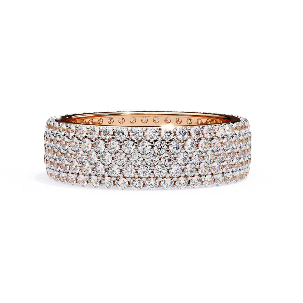 The Niraa Glimmering Diamond Eternity Band boasts five luxurious rows of closely set, round-cut white diamonds against a white background, highlighting its elegant craftsmanship and sparkle.