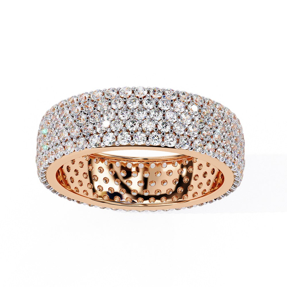 The Niraa Glimmering Diamond Eternity Band boasts five luxurious rows of closely set, round-cut white diamonds against a white background, highlighting its elegant craftsmanship and sparkle.