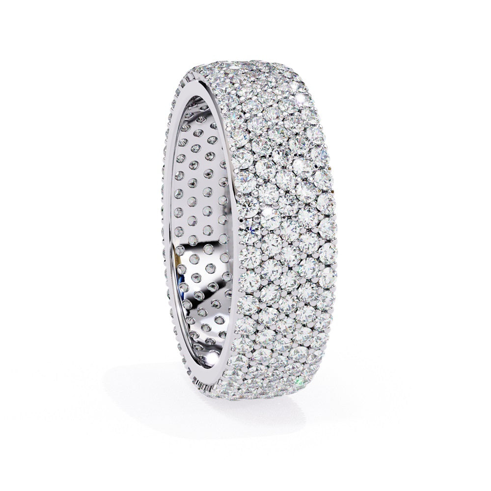 The Niraa Glimmering Diamond Eternity Band boasts five luxurious rows of closely set, round-cut white diamonds against a white background, highlighting its elegant craftsmanship and sparkle.
