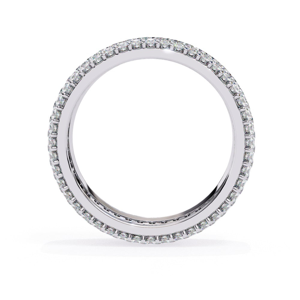 The Niraa Glimmering Diamond Eternity Band boasts five luxurious rows of closely set, round-cut white diamonds against a white background, highlighting its elegant craftsmanship and sparkle.