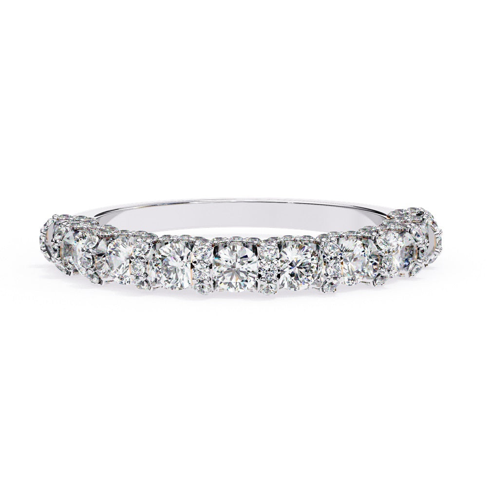 Discover the allure of Niraas Garland Diamond Band, a luxurious gold ring adorned with large, round, sparkling diamonds elegantly covering two-thirds of its surface, beautifully revealing the gleaming gold beneath.