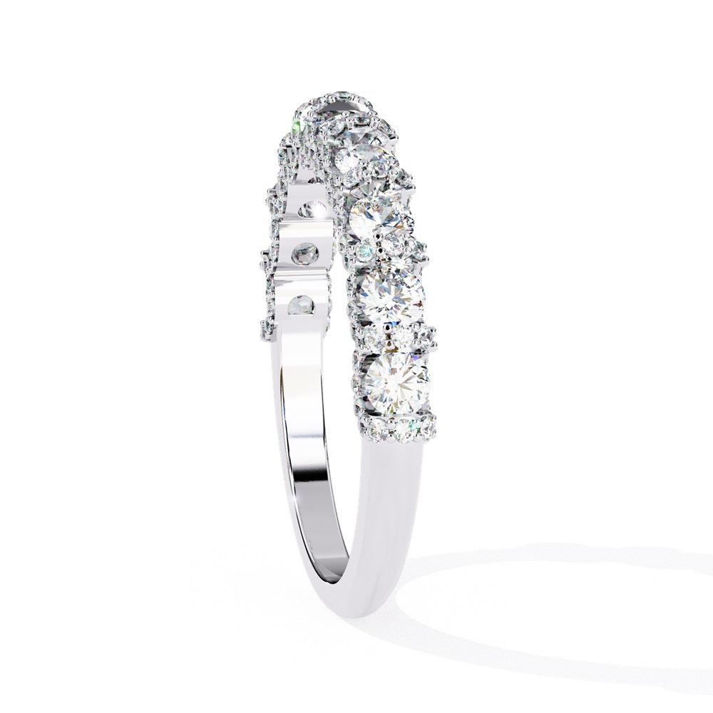Discover the allure of Niraas Garland Diamond Band, a luxurious gold ring adorned with large, round, sparkling diamonds elegantly covering two-thirds of its surface, beautifully revealing the gleaming gold beneath.