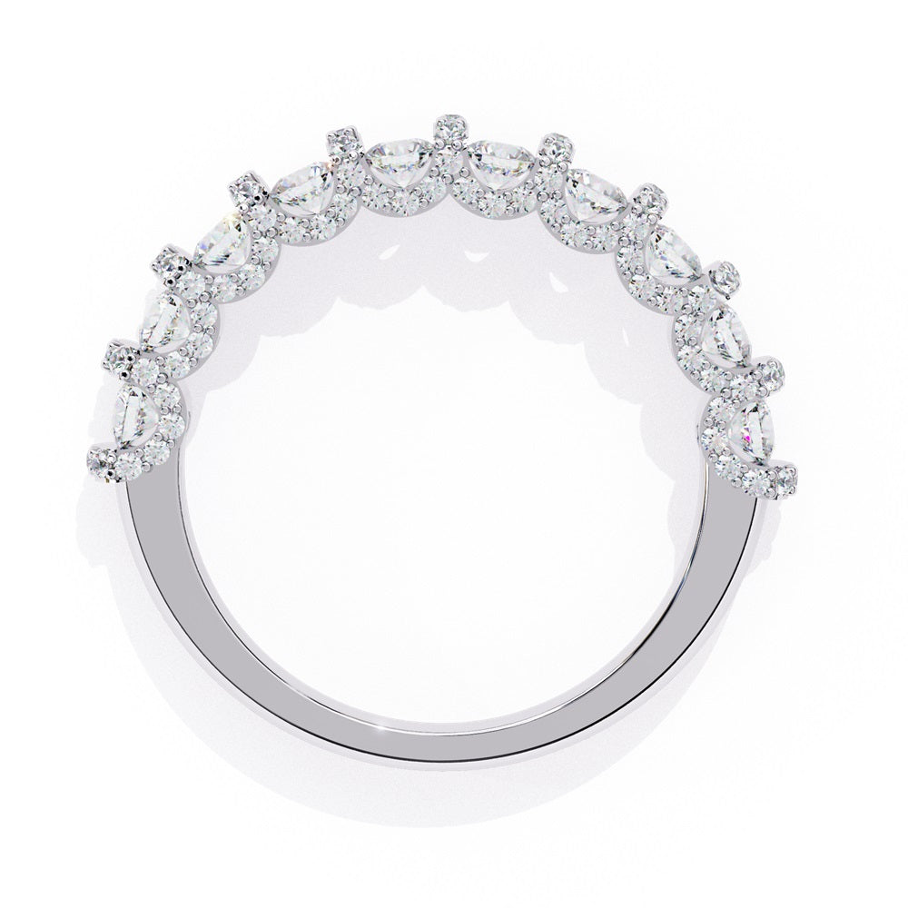Discover the allure of Niraas Garland Diamond Band, a luxurious gold ring adorned with large, round, sparkling diamonds elegantly covering two-thirds of its surface, beautifully revealing the gleaming gold beneath.