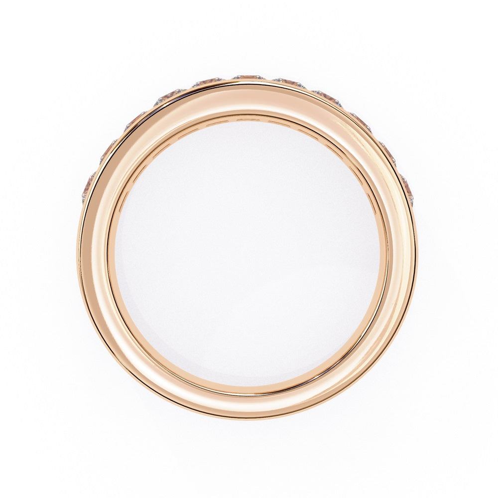 The Niraa Princess Channel Diamond Band is a stunning gold piece featuring square-cut, clear gemstones in a channel setting, elegantly viewed from the side against a plain white background.