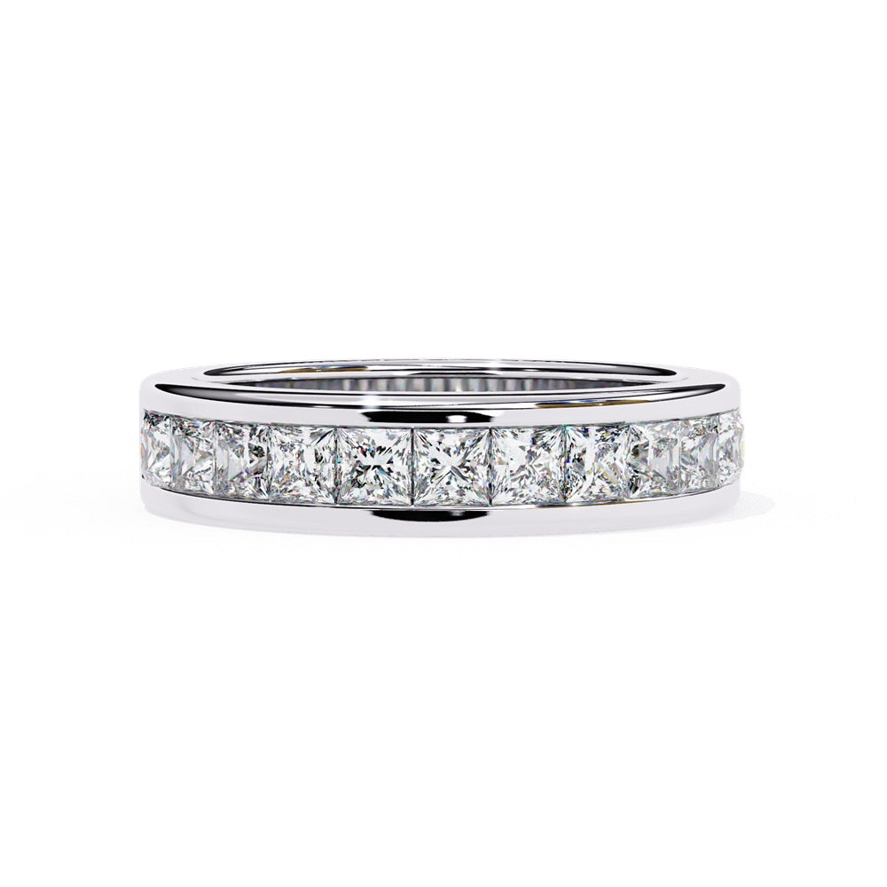 The Niraa Princess Channel Diamond Band is a stunning gold piece featuring square-cut, clear gemstones in a channel setting, elegantly viewed from the side against a plain white background.
