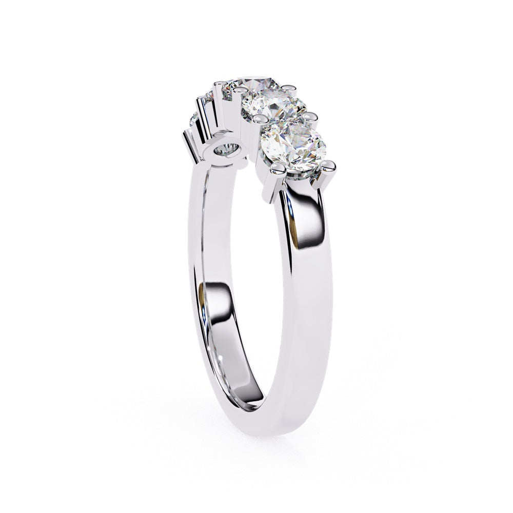 Niraas Five Stone Diamond Band is a stunning gold ring with five round brilliant-cut diamonds in an elegant prong setting. Each stone comes with a diamond certificate, highlighting their clarity and sparkle against the sleek gold band.