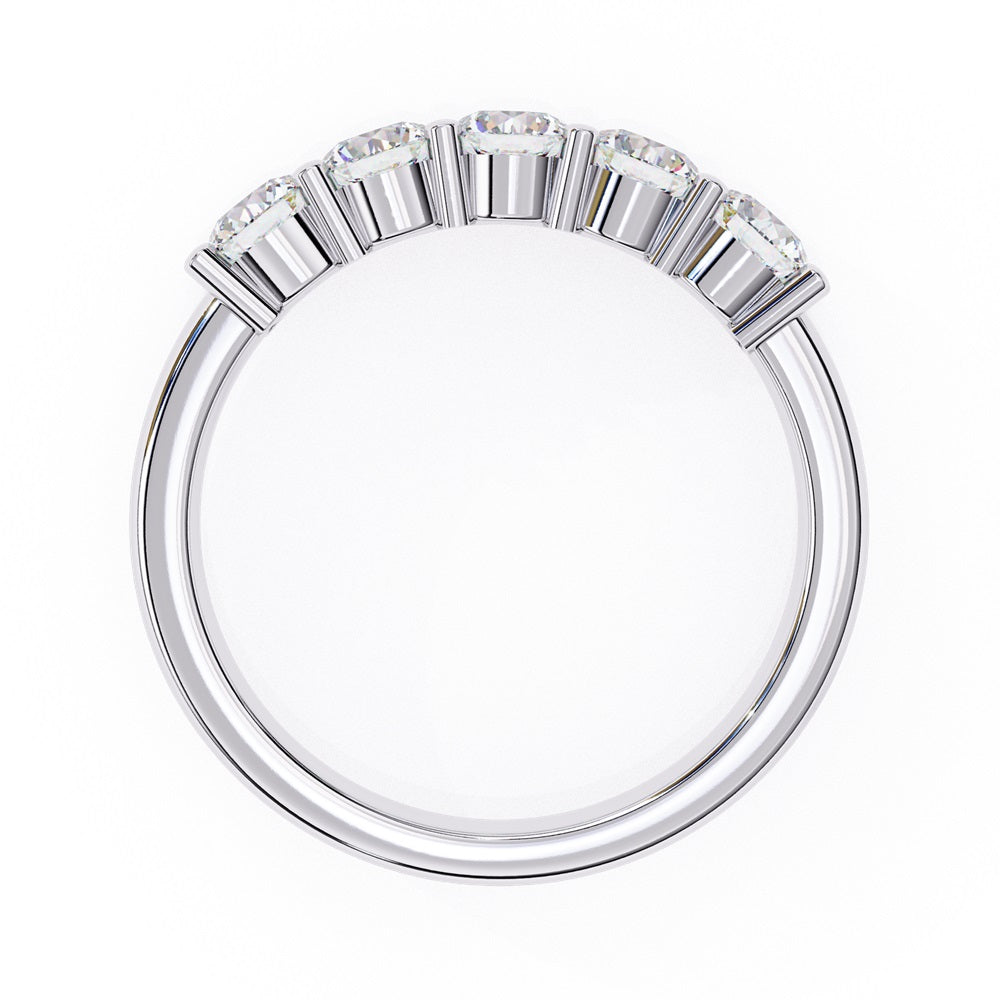 Niraas Five Stone Diamond Band is a stunning gold ring with five round brilliant-cut diamonds in an elegant prong setting. Each stone comes with a diamond certificate, highlighting their clarity and sparkle against the sleek gold band.