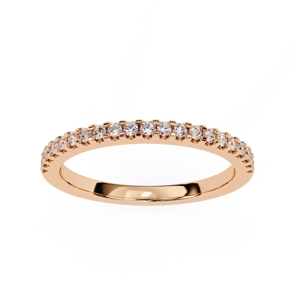 The Niraa Hope Diamond Band is a luxurious gold ring featuring a single row of small, sparkling diamonds. Its polished finish enhances the brilliance, making it truly exquisite.