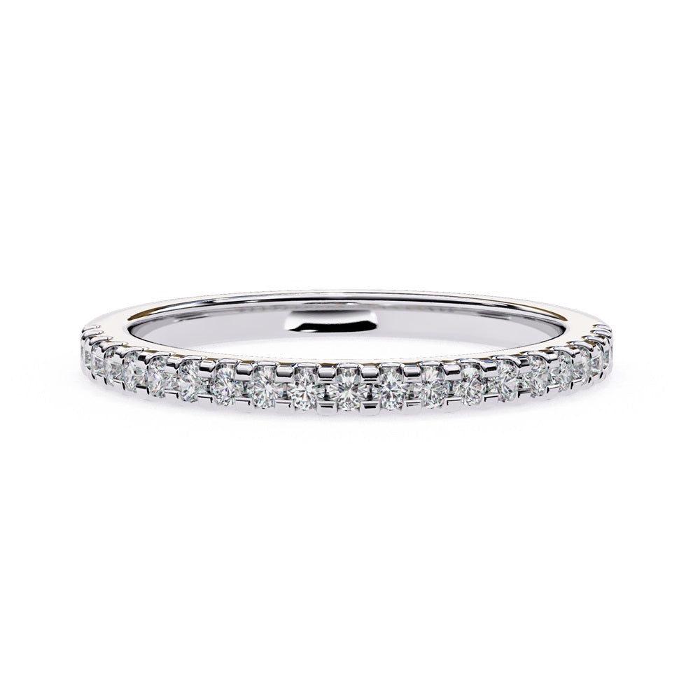 The Niraa Hope Diamond Band is a luxurious gold ring featuring a single row of small, sparkling diamonds. Its polished finish enhances the brilliance, making it truly exquisite.
