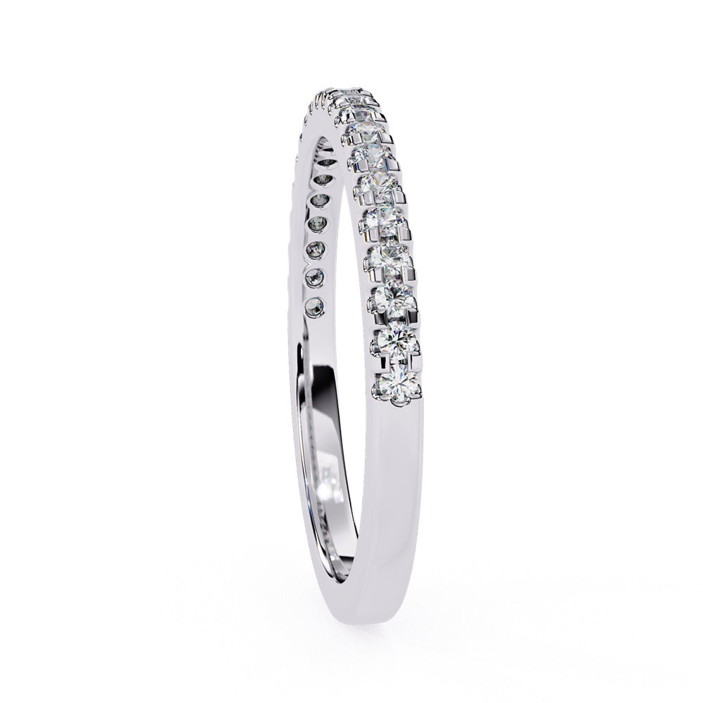 The Niraa Hope Diamond Band is a luxurious gold ring featuring a single row of small, sparkling diamonds. Its polished finish enhances the brilliance, making it truly exquisite.