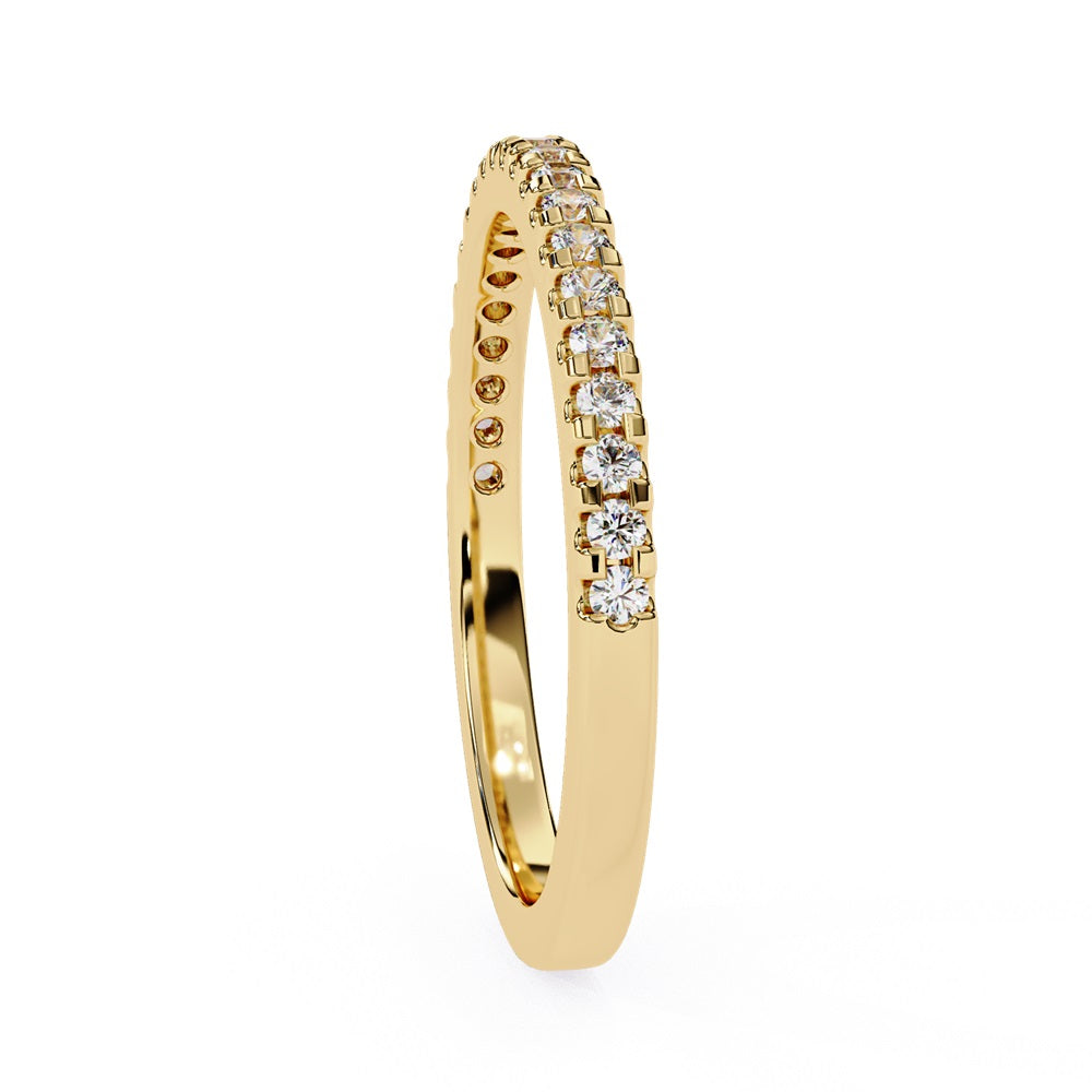 The Niraa Hope Diamond Band is a luxurious gold ring featuring a single row of small, sparkling diamonds. Its polished finish enhances the brilliance, making it truly exquisite.