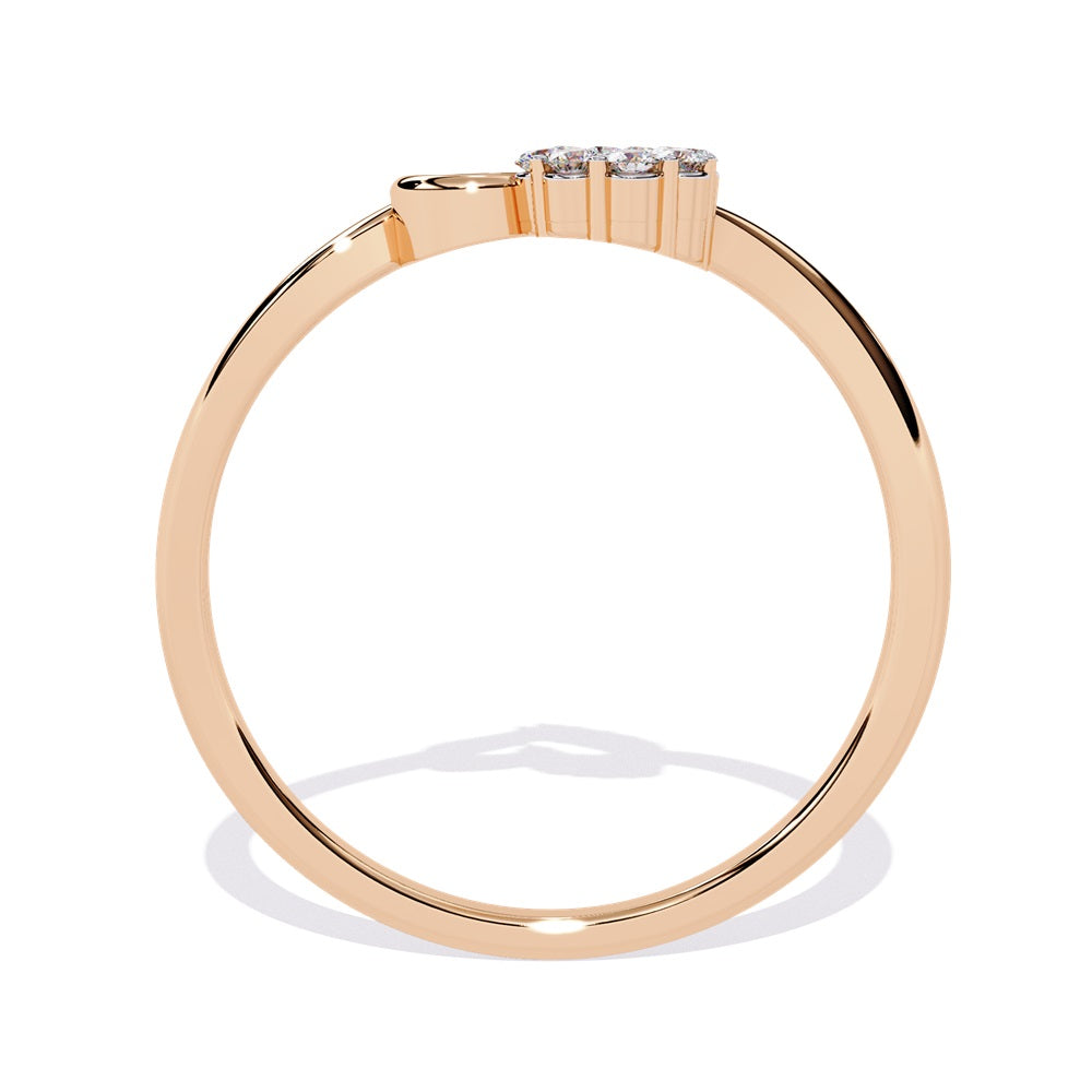 An exquisite gold ring in the shape of a heart, featuring dazzling diamonds that enhance its romantic charm.