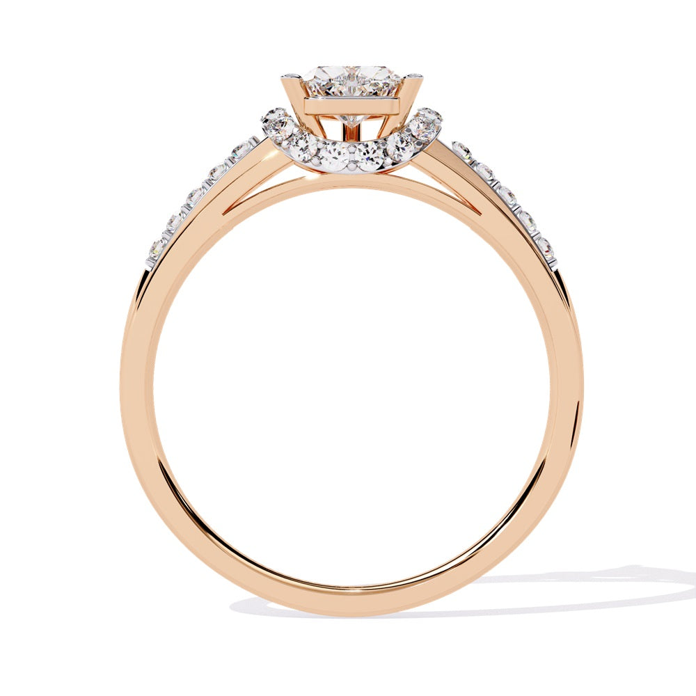 A gold solitaire engagement ring featuring a heart-shaped diamond surrounded by a delicate halo of smaller stones.