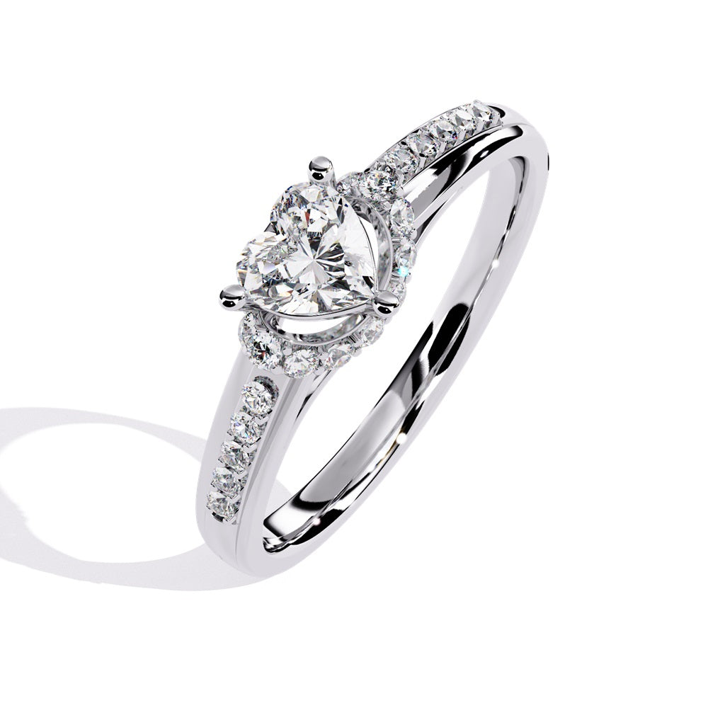 A gold solitaire engagement ring featuring a heart-shaped diamond surrounded by a delicate halo of smaller stones.