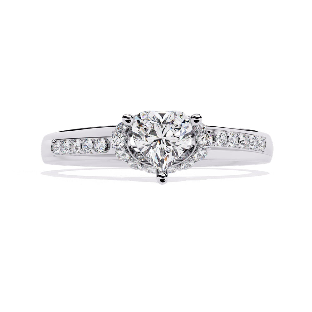A gold solitaire engagement ring featuring a heart-shaped diamond surrounded by a delicate halo of smaller stones.