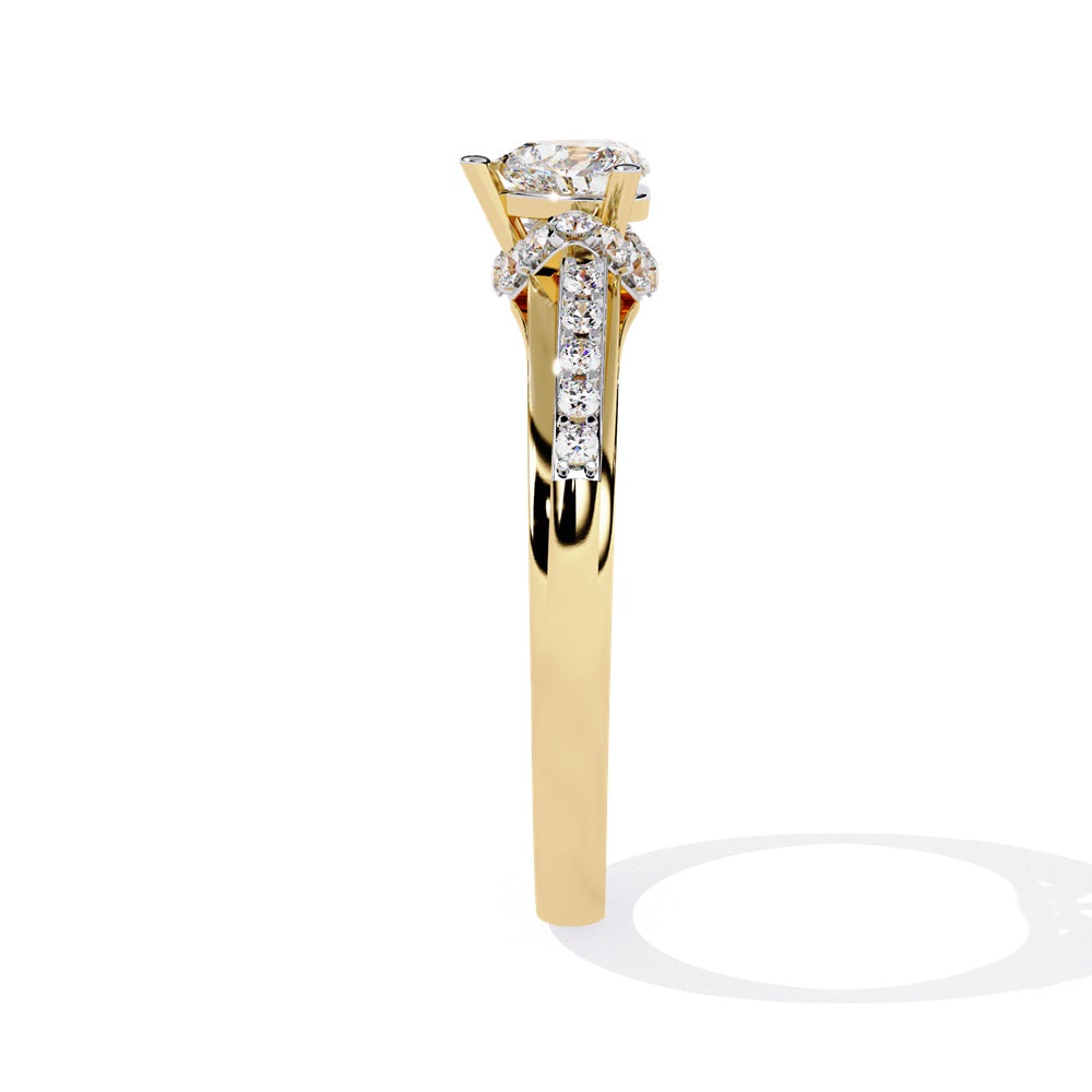 A gold solitaire engagement ring featuring a heart-shaped diamond surrounded by a delicate halo of smaller stones.