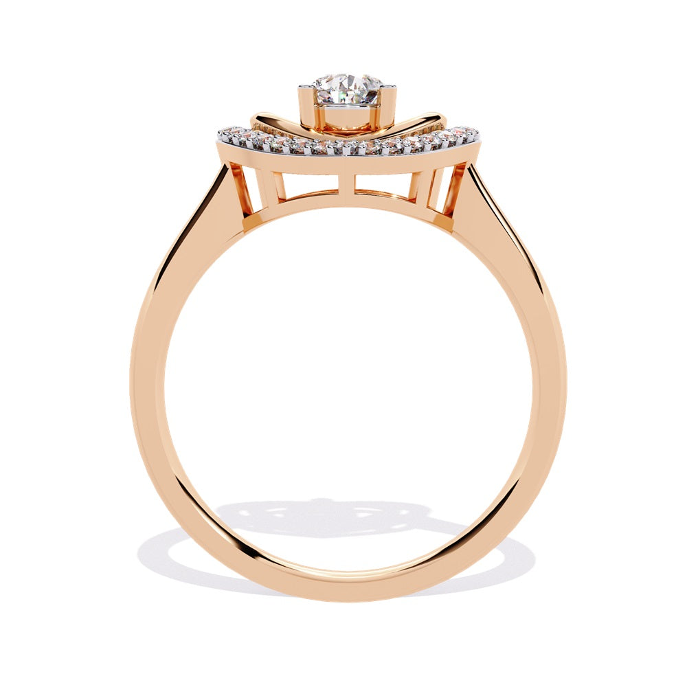 A pear-shaped diamond ring in gold, encircled by smaller diamonds, forming a heart shape around the centerpiece.
