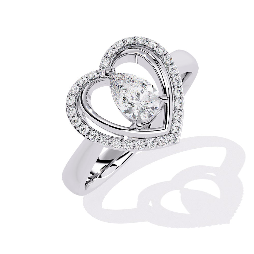 A pear-shaped diamond ring in gold, encircled by smaller diamonds, forming a heart shape around the centerpiece.