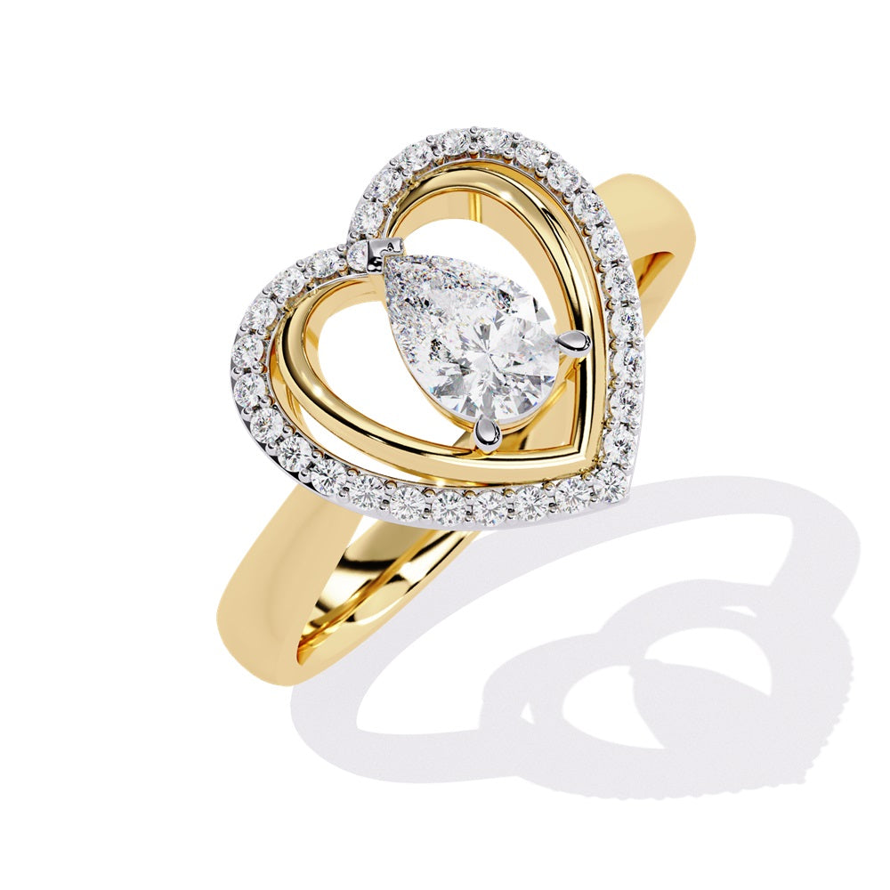 A pear-shaped diamond ring in gold, encircled by smaller diamonds, forming a heart shape around the centerpiece.