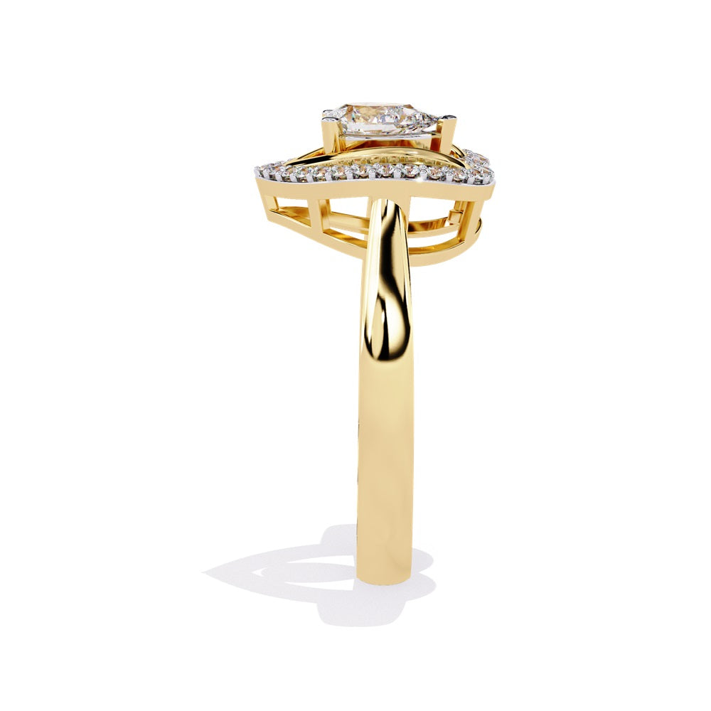 A pear-shaped diamond ring in gold, encircled by smaller diamonds, forming a heart shape around the centerpiece.