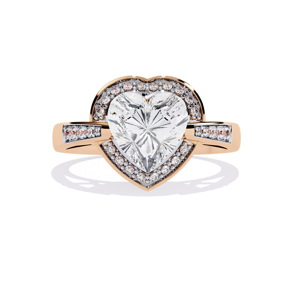 A heart-shaped diamond ring in gold, featuring a solitaire design with a halo of smaller diamonds surrounding it.