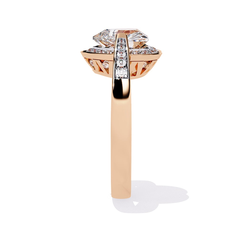 A heart-shaped diamond ring in gold, featuring a solitaire design with a halo of smaller diamonds surrounding it.