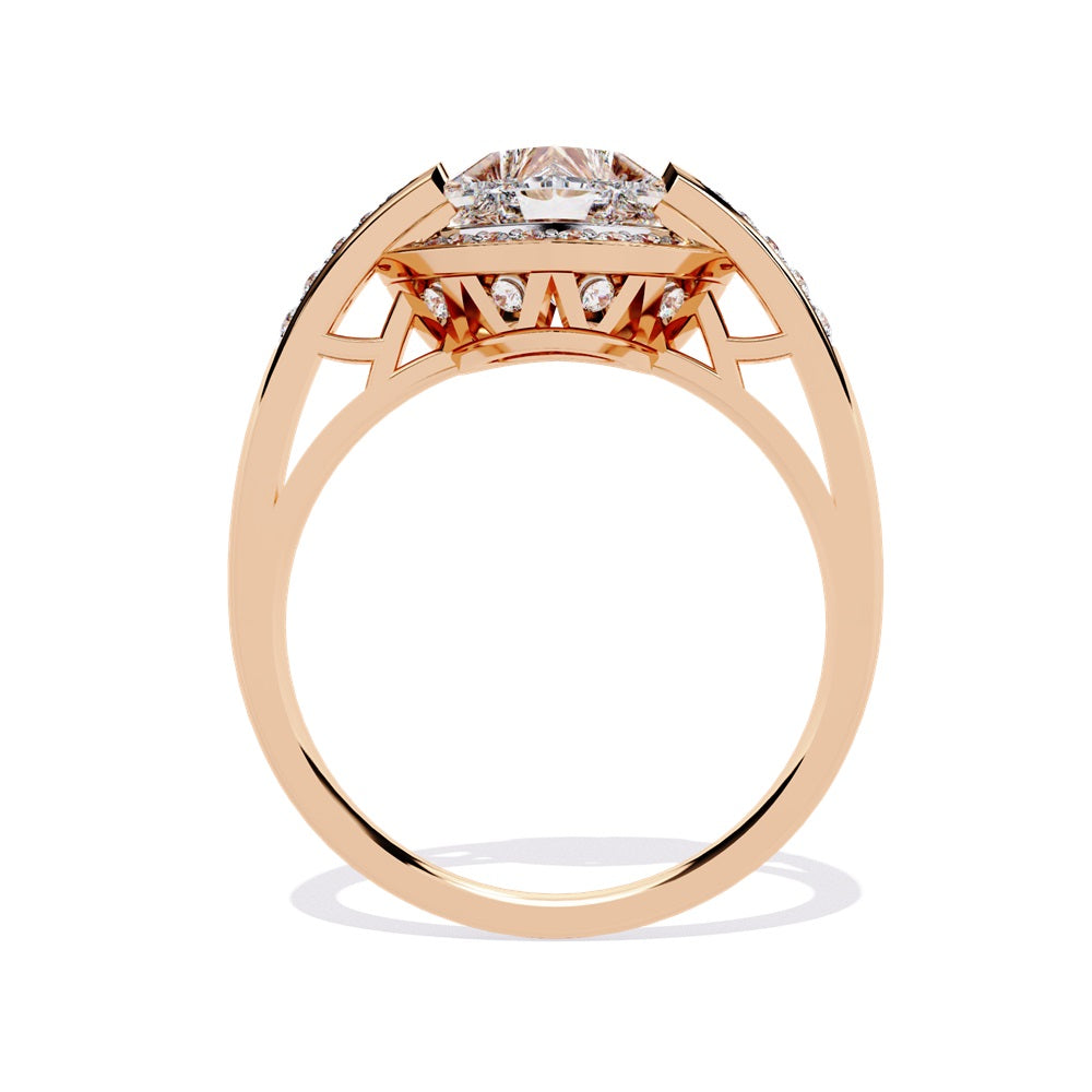 A heart-shaped diamond ring in gold, featuring a solitaire design with a halo of smaller diamonds surrounding it.