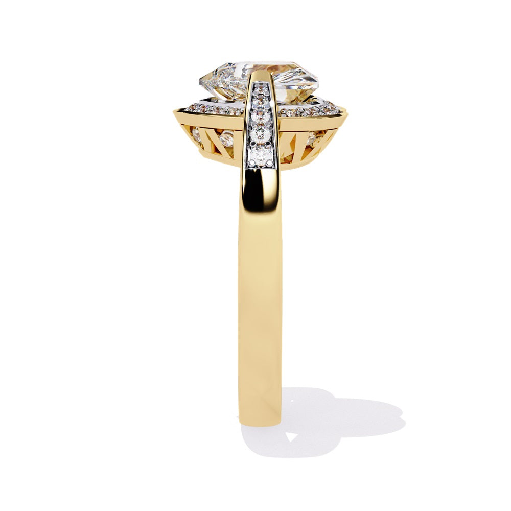 A heart-shaped diamond ring in gold, featuring a solitaire design with a halo of smaller diamonds surrounding it.