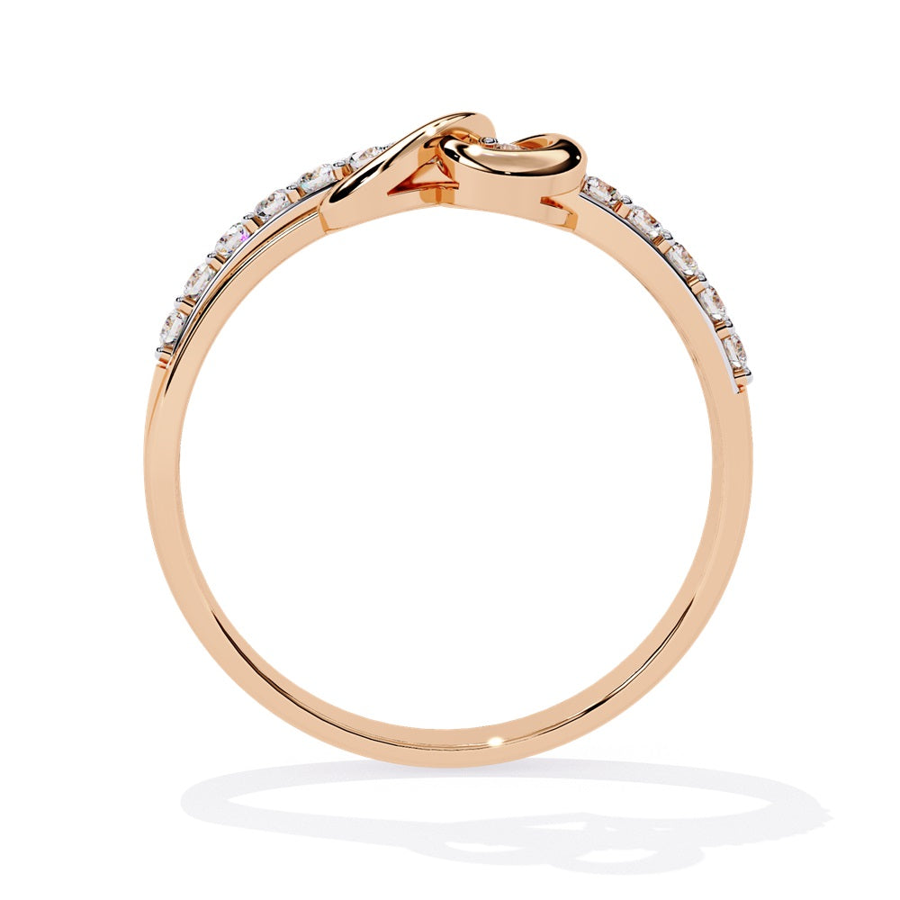 An exquisite diamond studded gold band  featuring a heart in the centre reflecting a romantic touch.