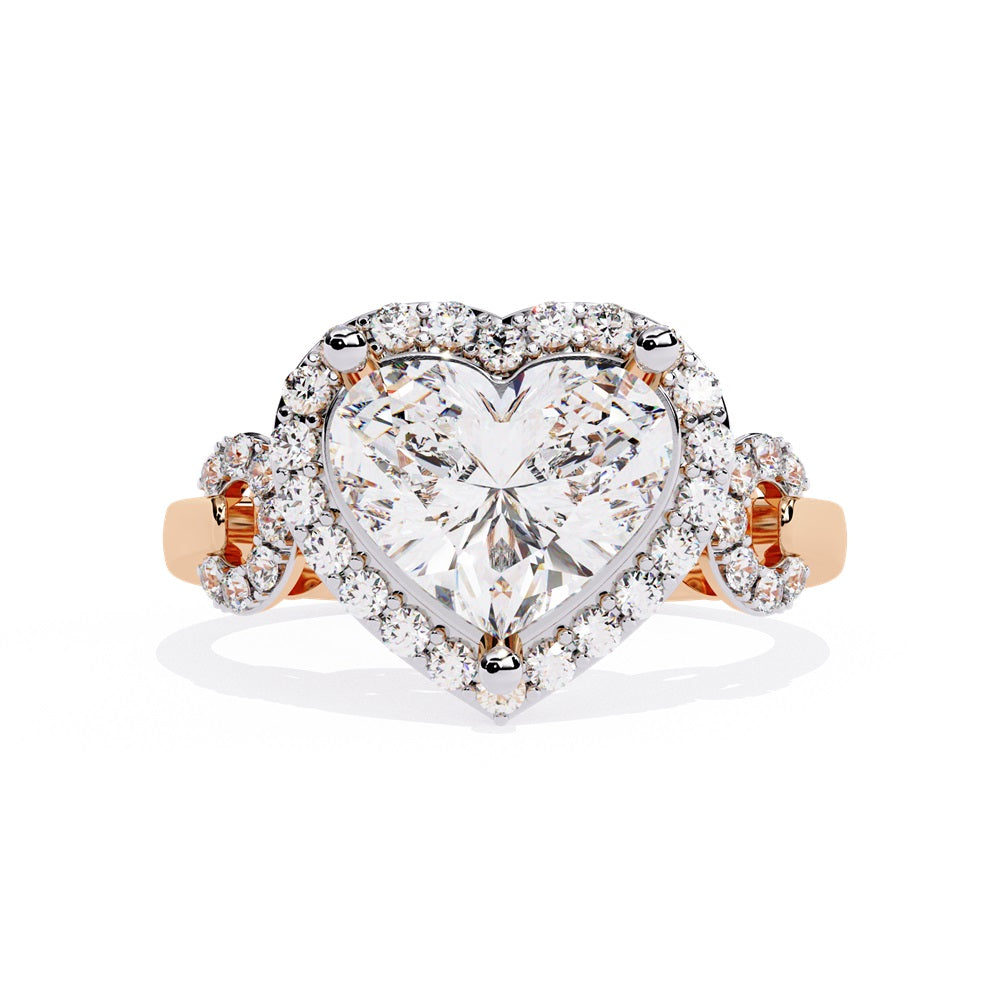 A heart-shaped diamond ring in gold, featuring a solitaire design with a halo of smaller diamonds surrounding it.