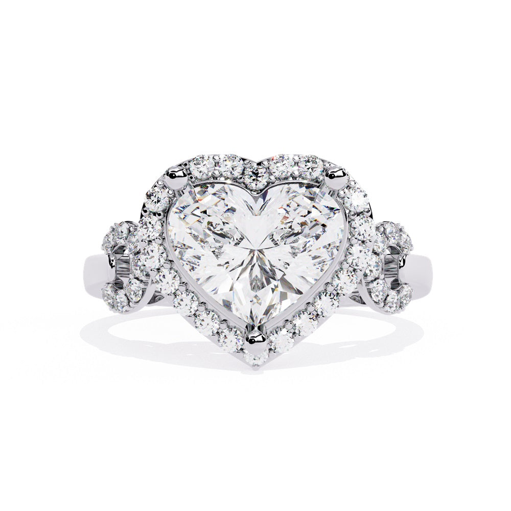 A heart-shaped diamond ring in gold, featuring a solitaire design with a halo of smaller diamonds surrounding it.