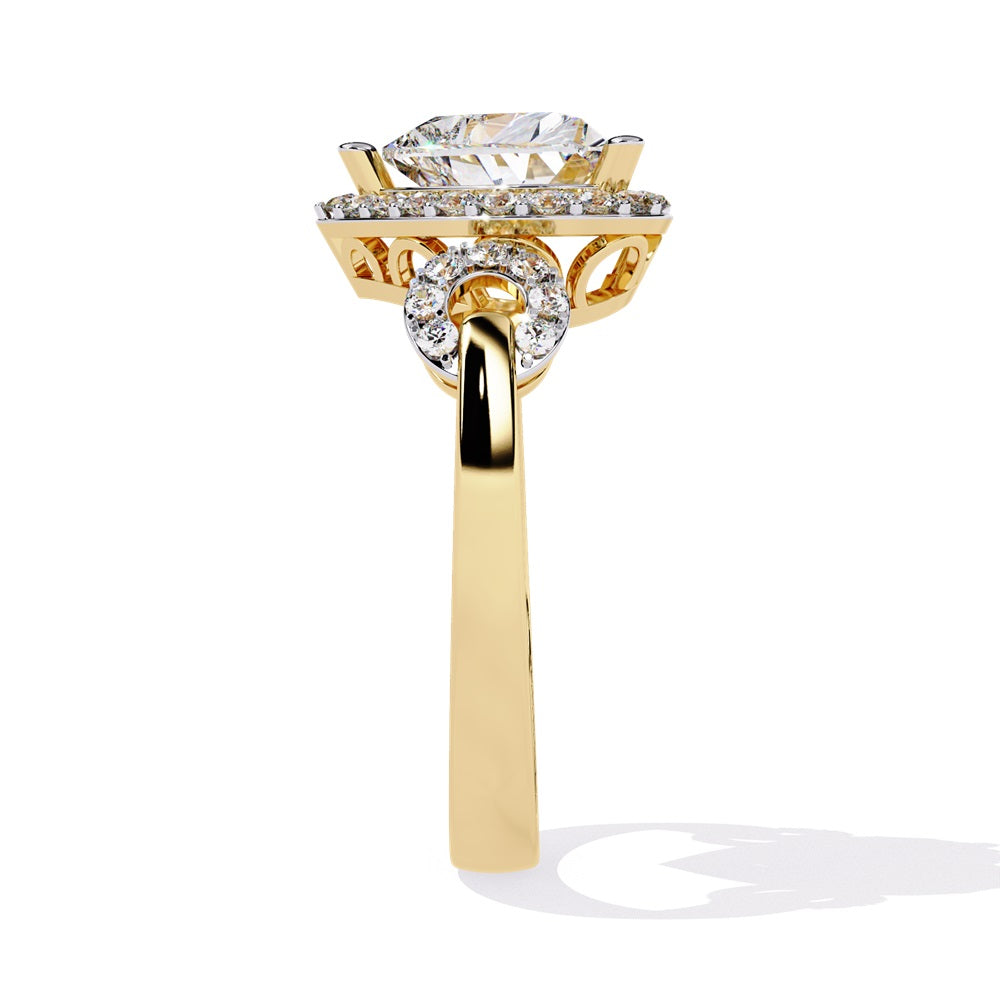 A heart-shaped diamond ring in gold, featuring a solitaire design with a halo of smaller diamonds surrounding it.