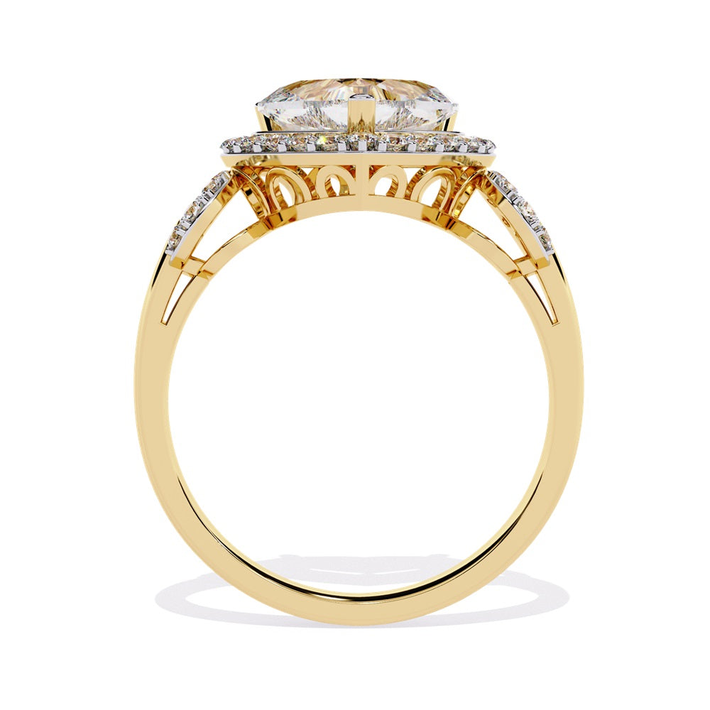 A heart-shaped diamond ring in gold, featuring a solitaire design with a halo of smaller diamonds surrounding it.