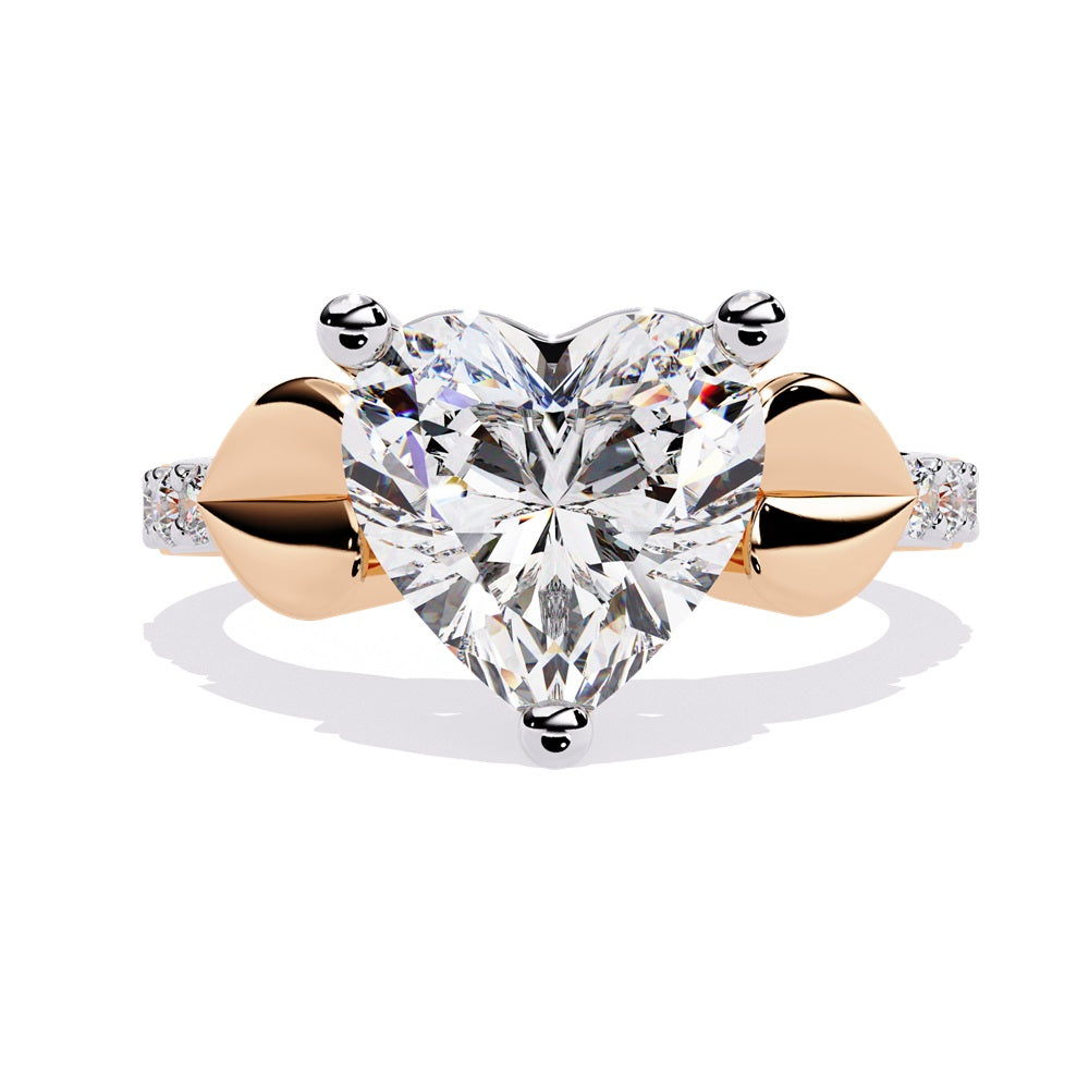 A stunning heart-shaped diamond engagement ring in gold featuring two gold hearts on either sides, perfect for a romantic proposal.