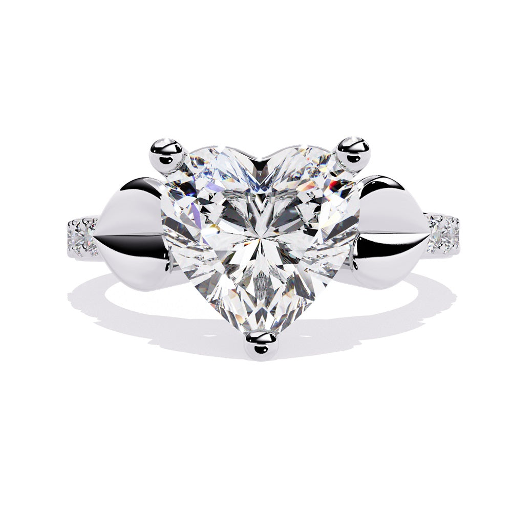 A stunning heart-shaped diamond engagement ring in gold featuring two gold hearts on either sides, perfect for a romantic proposal.